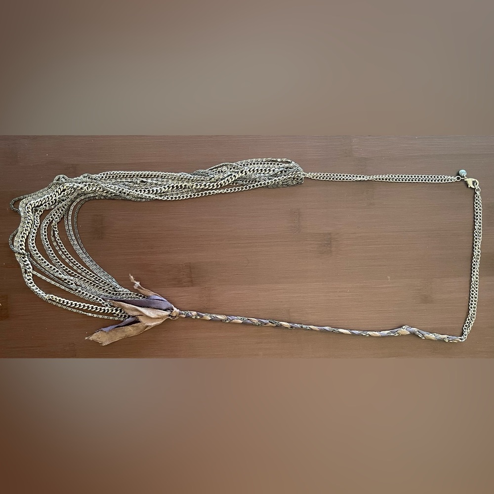 Long multistrand necklace with ribbon detail